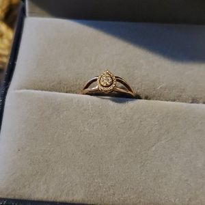 10k rose gold .13 TW diamond pear shape cluster